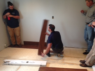 Keith Lacognata Luxury Vinyl Product Manager demonstrating an installation of San Simeon Luxury Vinyl flooring.