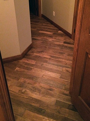 Organic Masala solid hardwood flooring installed a hallway room.