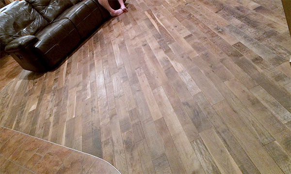 Organic Masala solid hardwood flooring installed a living room.