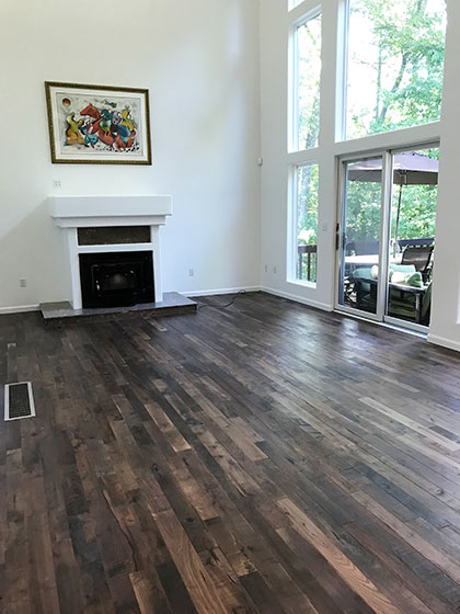 organic solid tamarind installation in living-room by adams family flooring