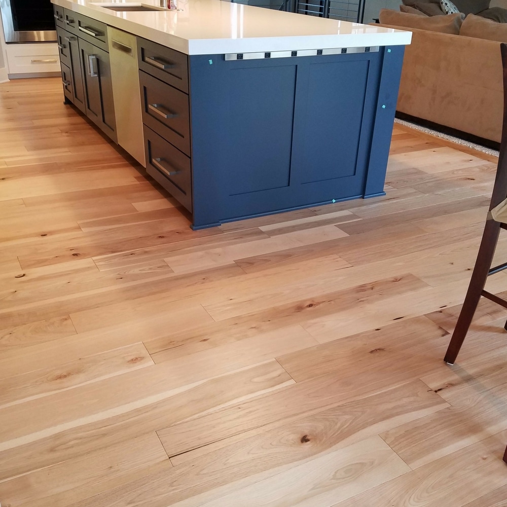 Blue cabinets with Hallmark Wide-Plank Hickory hardwood