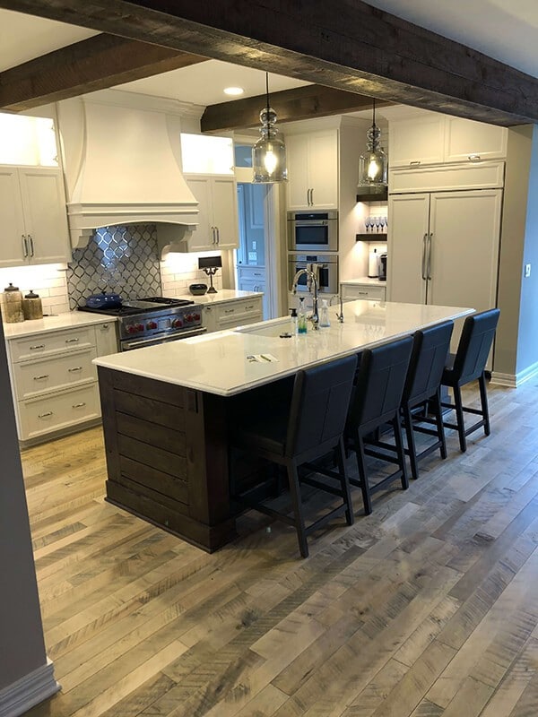 Contemporary rustic kitchen design with Cassia Maple, Organic wood flooring. Installed in a home in Omaha, NE. Organic wood floors by Hallmark Floors Inc.