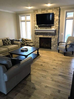 Cassia Maple, organic wood flooring, installed in a family room. in a home in Omaha, NE. Organic wood floors by Hallmark Floors Inc.