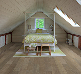 Product Corral Maple, Chaparral flooring in a bedroom by Hallmark Floors.