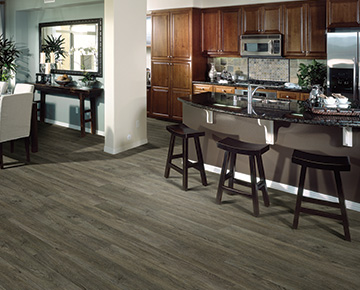 The flooring is Champlain Oak from the Polaris 12mil Waterproof flooring collection.