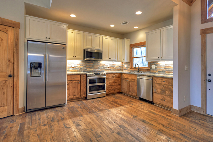 Hallmark Floors Organic Solid Tulsi Hickory cabin kitchen installation by Dalton Wholesale Flooring Hallmark Floors Organic Solid Tulsi Hickory cabin kitchen installation by Dalton Wholesale Flooring