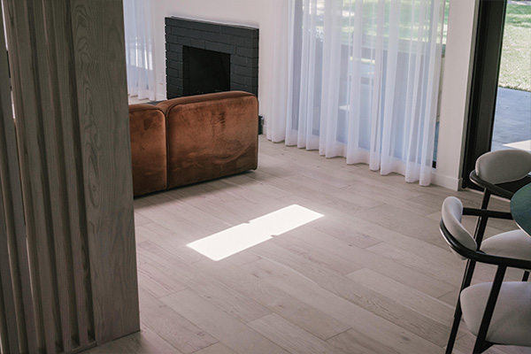 Modern Farmhouse Renovation has Alta Vista Del Mar hardwood flooring throughout the home.